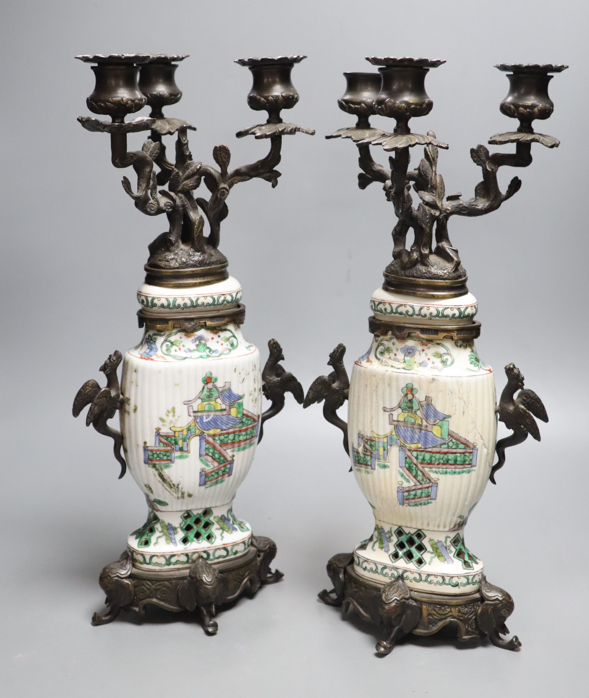 A pair of Chinese famille verte vases converted to candelabra, height 41cm